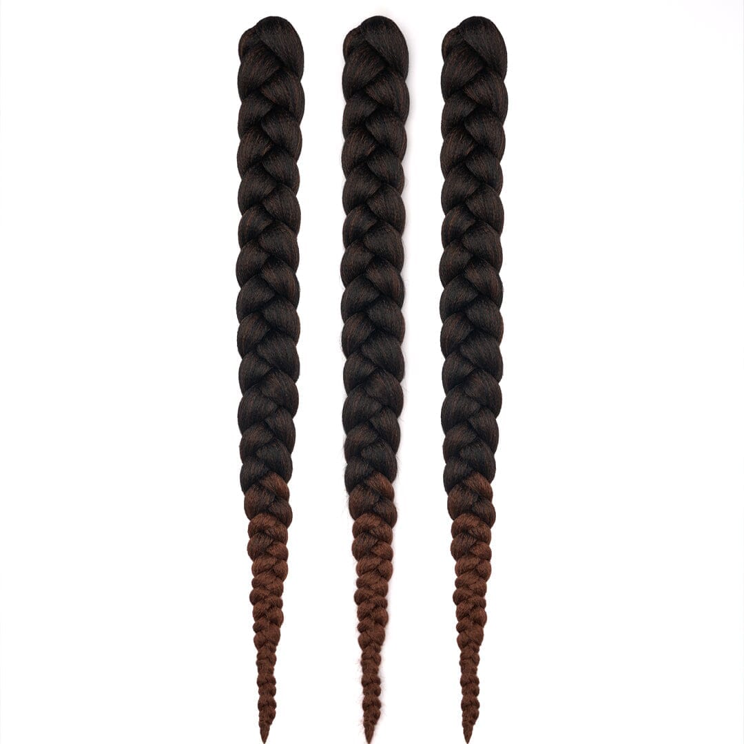 Three bundles of 28" braided hair in ombré black to dark brown, laying on a white field.