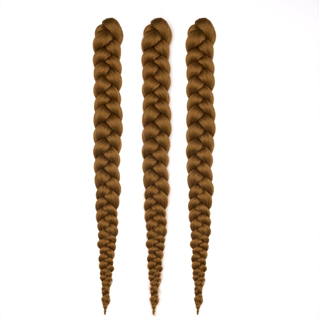 Three bundles of 28" braided hair in golden brown, laying on a white field.