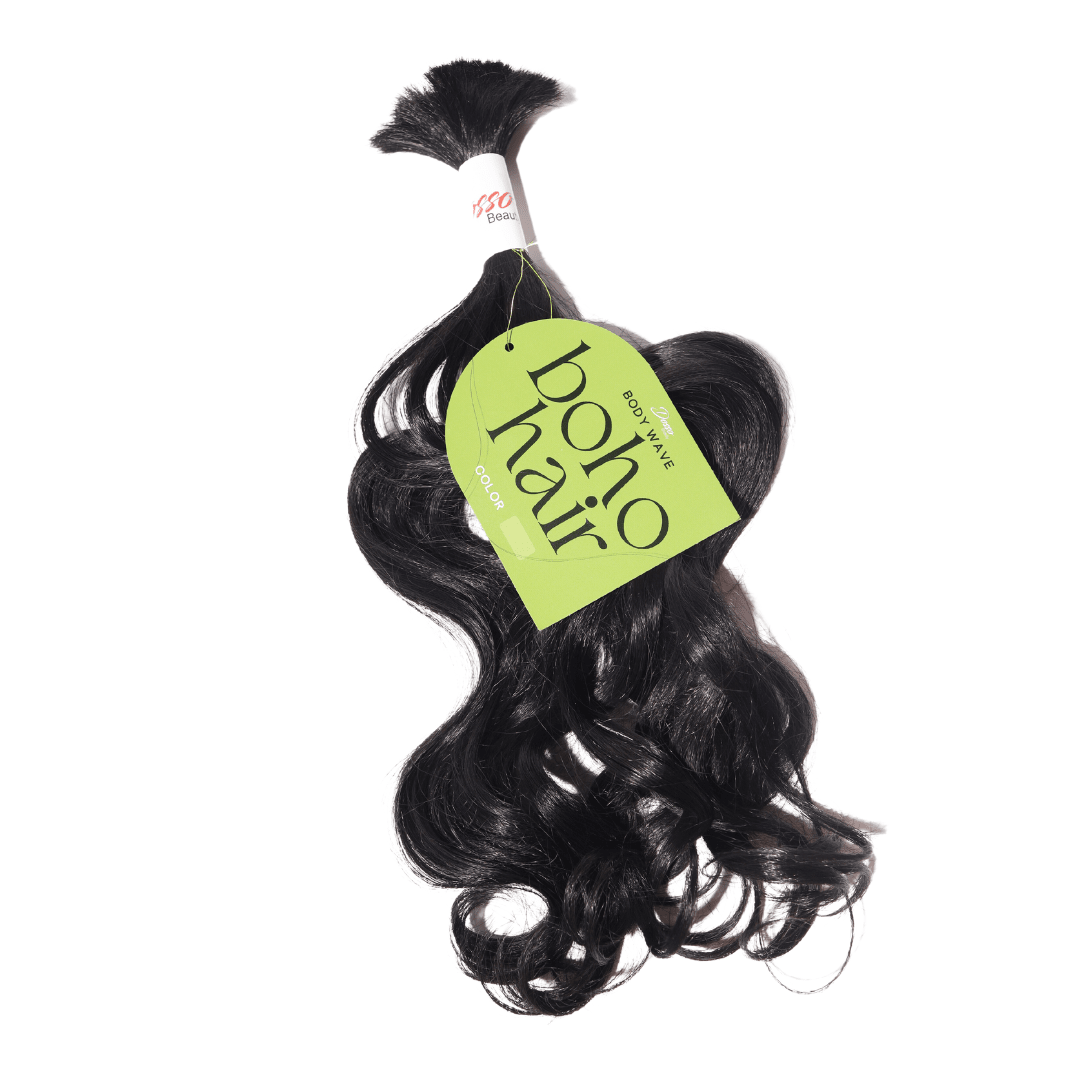 A bundle of wavy black hair extensions, with an olive-green tag wrapped around the top that reads "Boho Hair."