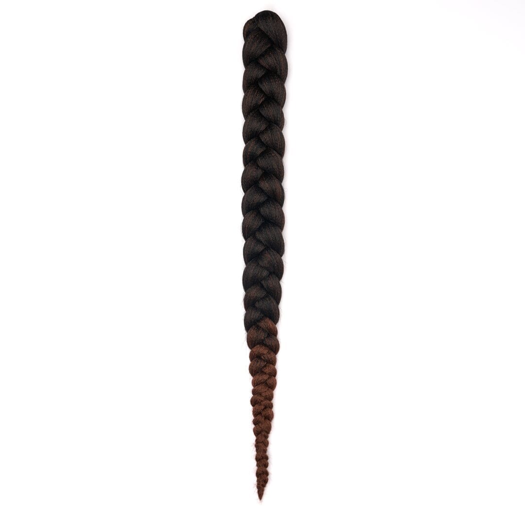A length of braided hair in ombré black to brown on a white field.
