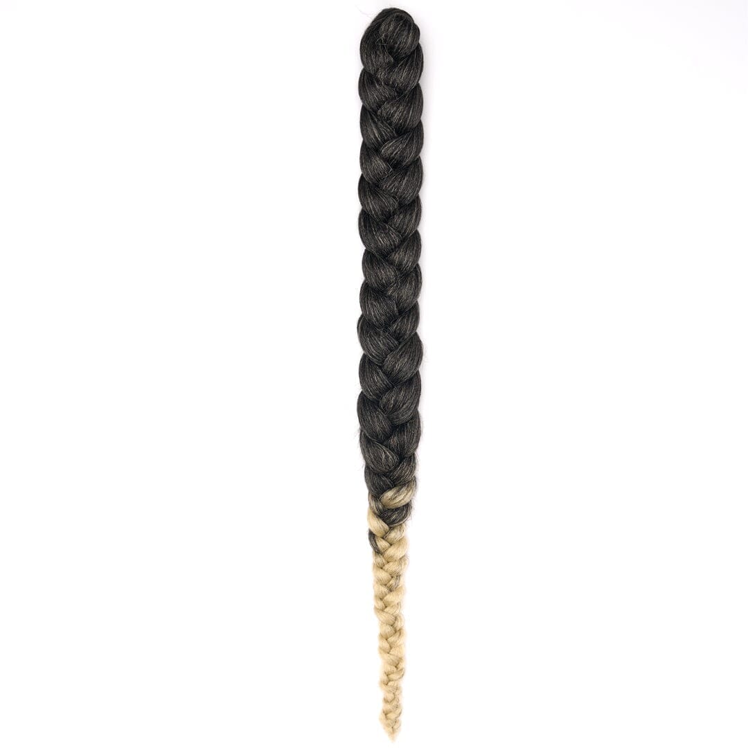 A length of braided hair in ombré charcoal to blonde on a white field.