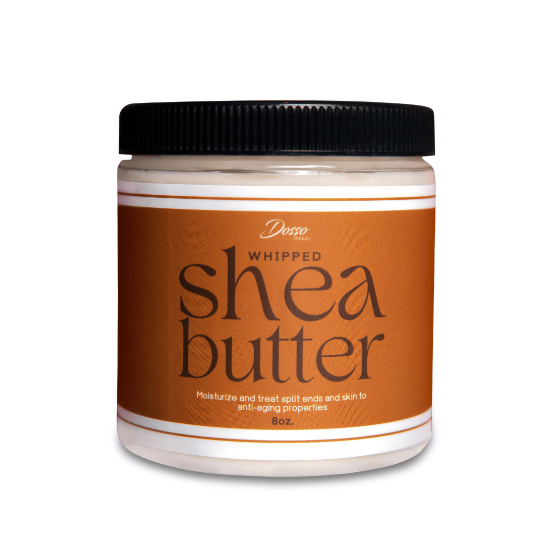 A translucent round jar with a black lid. Jar is full of a white cream and has a label that reads "Whipped Shea Butter."